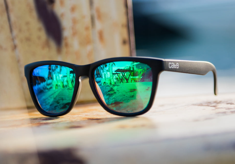 cab9_eyewear_stealth_green_revo_on_chair